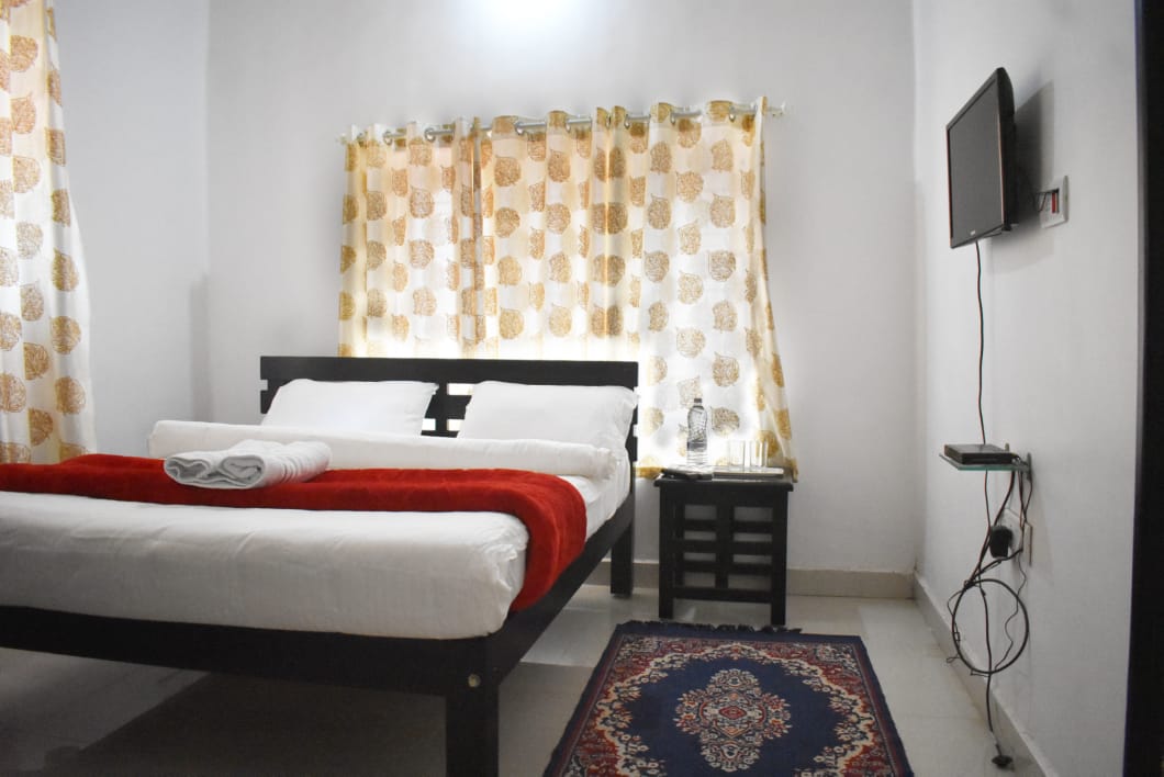 Deluxe bedroom at Coorg Green Nest homestay